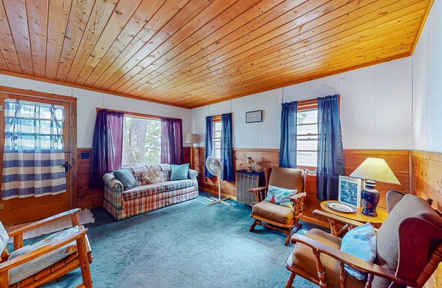 Charming lakefront cottage with large yard, dock, & fire pit - close to downtown