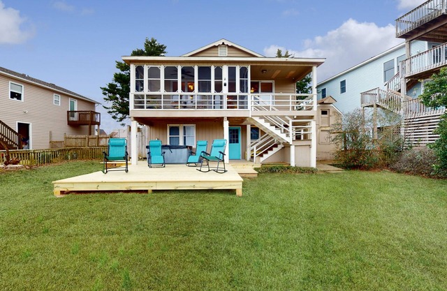 Charming retreat with waterfront views, beach access, pool, & private hot tub
