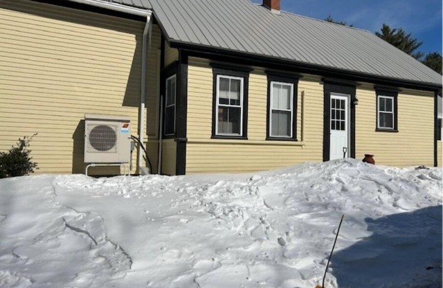 Charming threebedroom home-one bath with wraparound deck on 7 acres of land