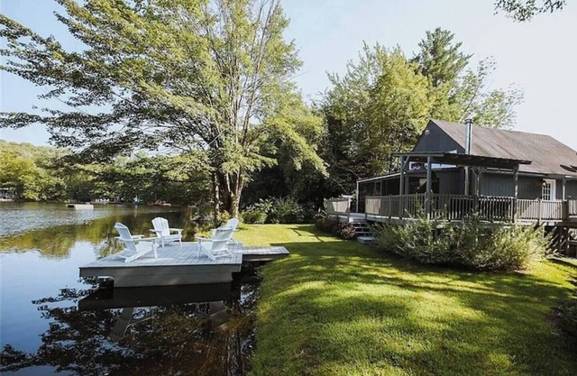 Chic lakefront retreat with year-round charm. Enjoy Lake Barnabee views, a fully stocked kitchen, and cozy vibes in a nostalgic lake community. Kayak in summer, skate in winter, and take advantage of fun in-home concierge services.