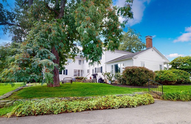 Classic country retreat with a game room, bar, expansive outdoor space, & grill