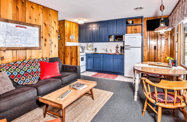 Classic, lakefront suite at a vintage resort with communal dock, firepit & views