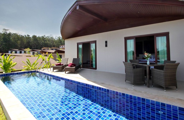 Villa Coconut Island con 2 camas y vistas al jardín