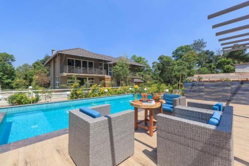 Coffee & Mist Luxury Villa- Comp Breakfast, Pool, Lounge, and Coffee Estate by StayVista