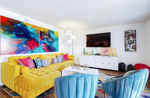 Colorful condo w/ a private balcony, gated entrance, shared pools