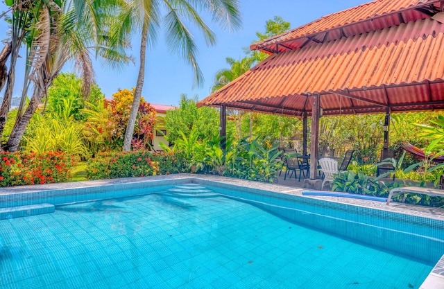Colorful, dog-friendly home with private pool, W/D, & lush setting