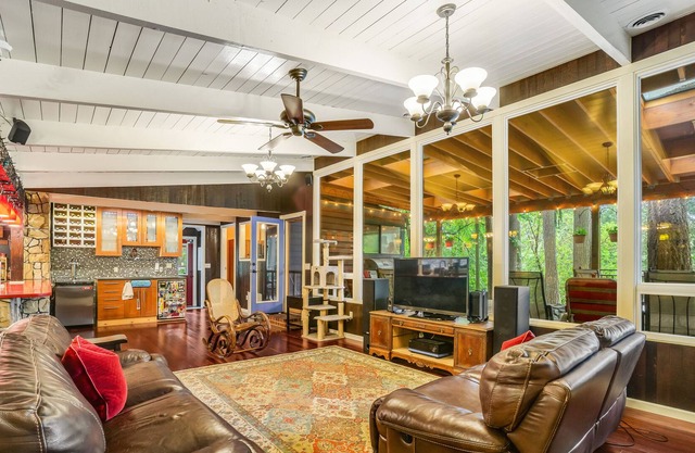 Colorful dog-friendly getaway with covered deck, firepit, fast WiFi, & grill