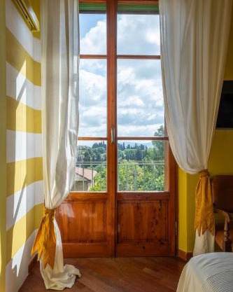 Colorful Tuscan Retreat Steps from Casole City Center