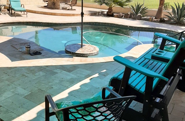 Comfortable and beautiful golf course home with inviting/accessorized backyard.