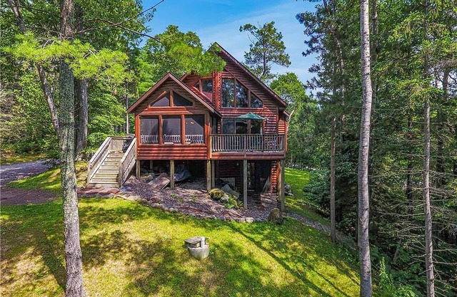 Comfortable lake home with sandy beach and private dock on LCO Lake