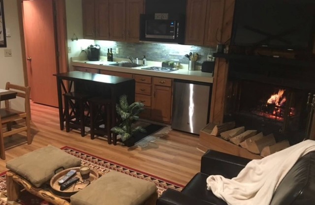 Condo that sleeps 8 near Torch Lake with a pool, hot tub, sauna and fitness room