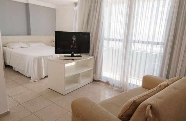 Confortável suíte integrada com vista mar em Natal por Carpediem
