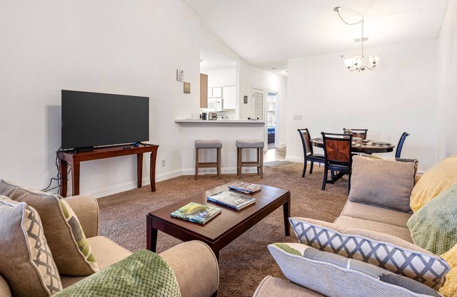 Contemporary golf retreat with private balcony, fast WiFi, central AC, & pool