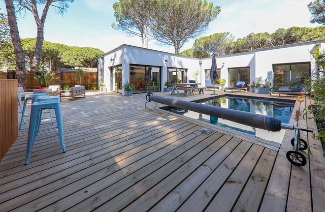 Contemporary house with heated pool in a magnificent pine forest