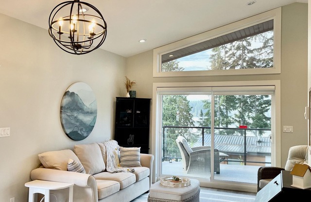 Contemporary lake cottage steps from private beach, dock & trails