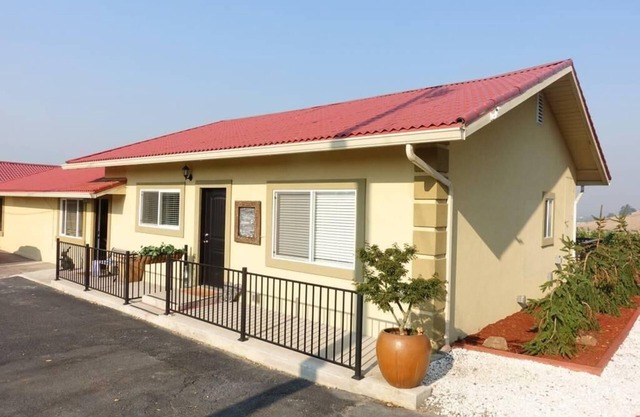 Cottage 1 offers a king-sized bed, dining area, full kitchen, hot tub.