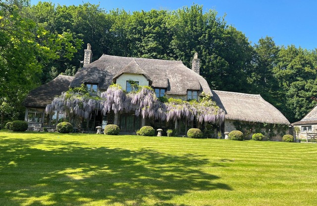 Country farmhouse surrounded by lakes green fields with private spa