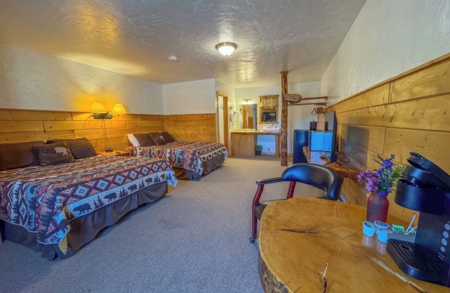 Embrace the Serenity of a Premium Double Queen Room with Breathtaking Riverfront Views and Stunning Mountain Backdrops!