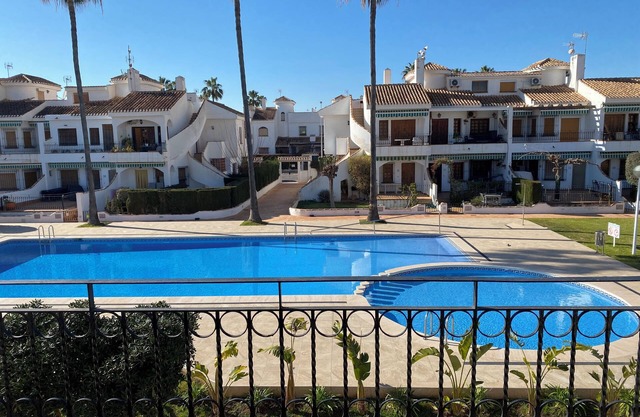 Cosy Bungalow with terrace overlooking swimming pool.