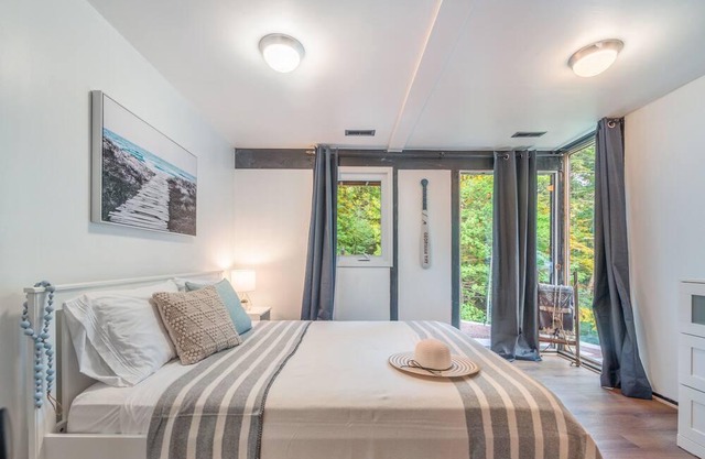 Cozy Cottage Across from Blue Waters with Hot Tub!