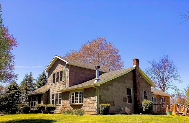 Cozy farmhouse nestled on 42 acres.