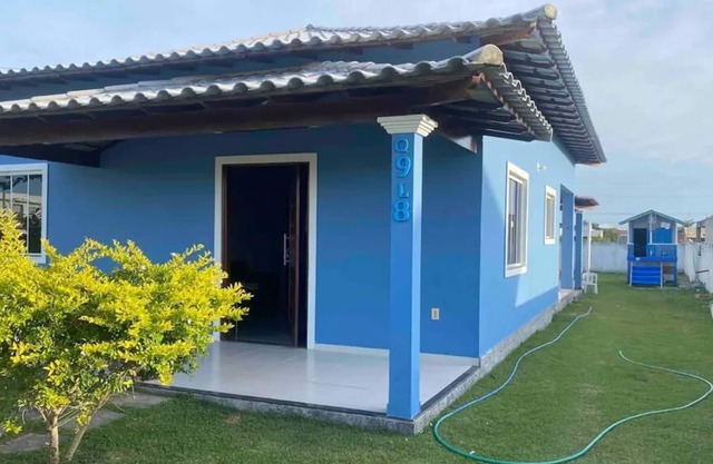 Cozy house with swimming pool in condominium with lagoon.