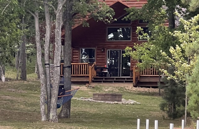Cozy lake-front home on crystal clear, all sports Long Lake in Hillman, MI.