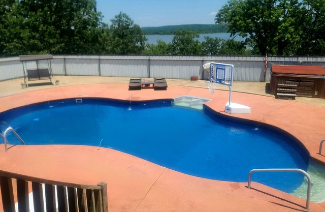 Cozy Lake home with pool, hot tub, private dock, game room and more!