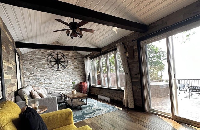 Cozy log cottage on the water with private dock.