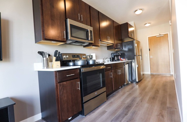 Cozy modern studio apartment with work out room, underground parking, and W/D