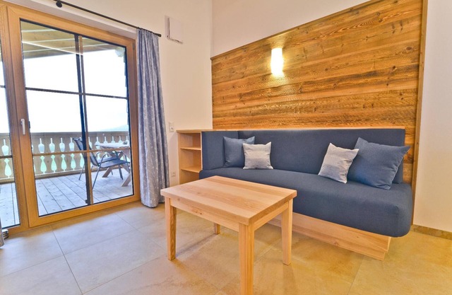 Cozy vacation apartment (70sqm) on the 1st floor with private balcony and exposed roof trusses