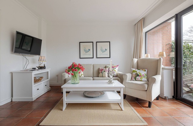 Cozy vacation happiness with garden view and south-facing terrace.