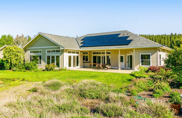 Creek-front home with great views, patio, sports court, & fireplace - dogs OK