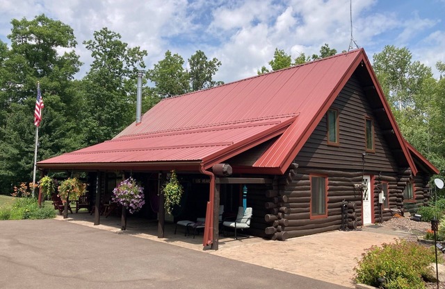 Custom built log home on 40 acres & in the woods! Snowmobile right from home!
