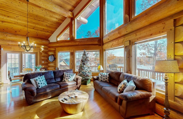 Custom-built lakefront home with lake views, firepit, fireplaces, dock, & deck