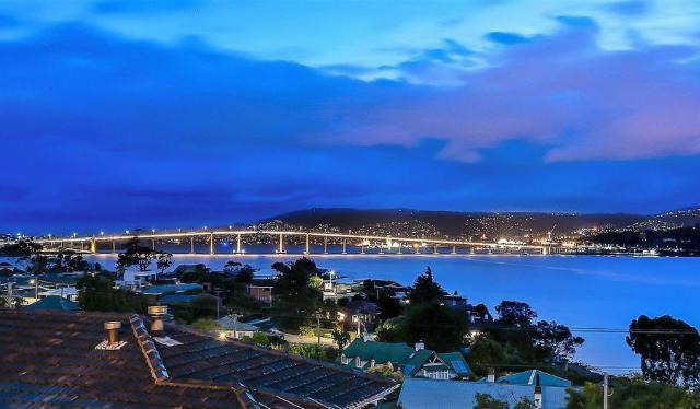 Deep Blue Wow views over river city mountain