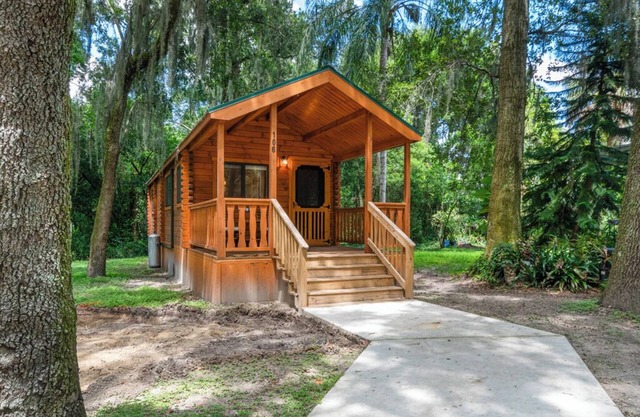 Deluxe Family Cabin with Porch - Happy Travelers RV Resort
