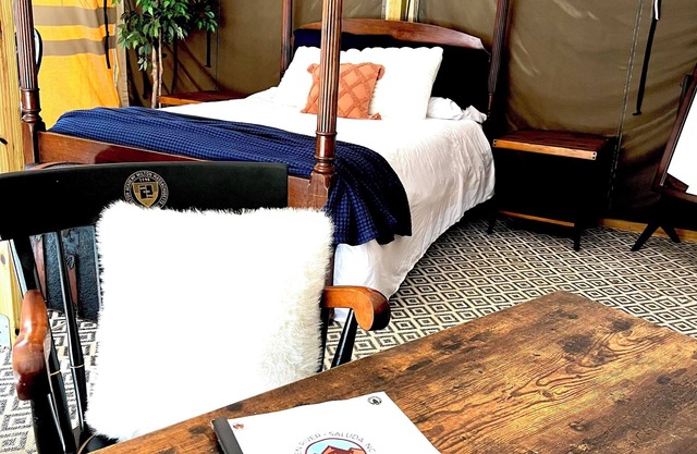 Deluxe Green River Glamping Tent in nature with wood burning oven!