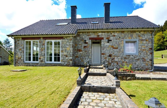 Detached natural stone house with sunny garden and terrace modern interior