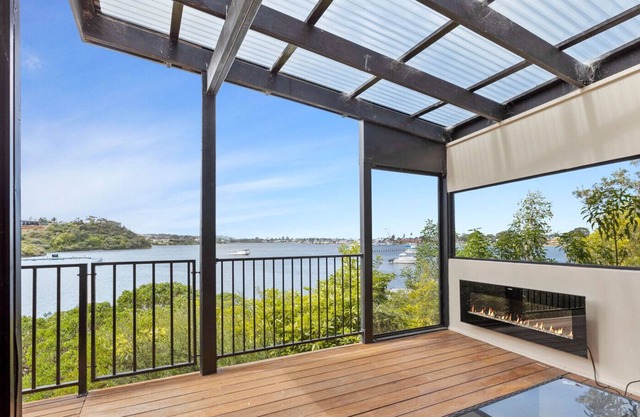 Discover coastal living perched on the tranquil edge of the glistening waters