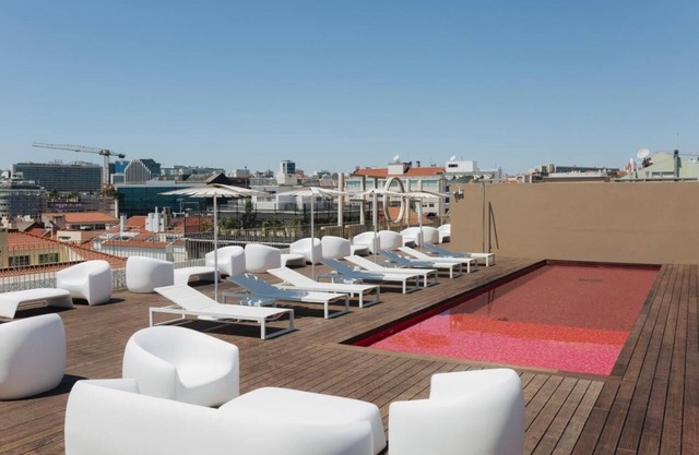 Dive into Lisbon Nights: Rooftop Pool & Magical Light Show Views