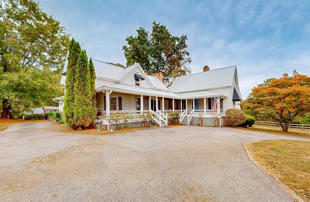 Dog-friendly farmhouse with hot tub, outdoor areas, & 3 fireplaces