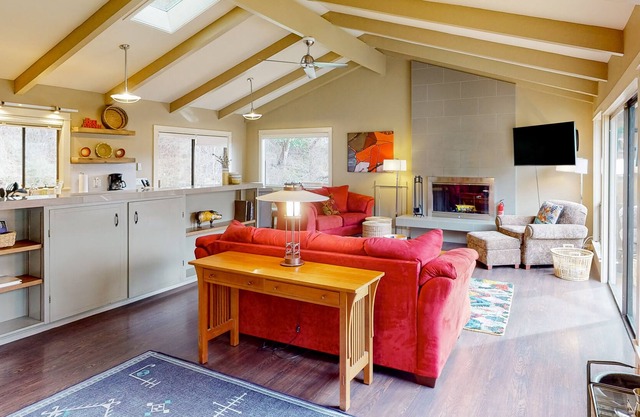 Dog-friendly forest cottage with a scenic deck, grill, fireplace, & central AC