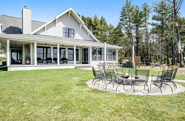 Dog-friendly, lakefront house with beach access, dock, AC, W/D, patio, & firepit