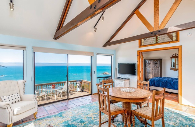 Dog-friendly, ocean-view cottage with private hot tub, deck, & free EV charger
