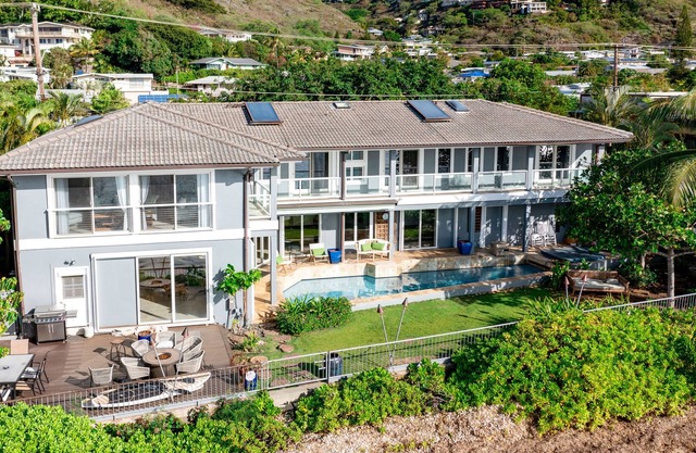 Dog-friendly oceanfront estate with a pool, hot tub, lanai, & private beach