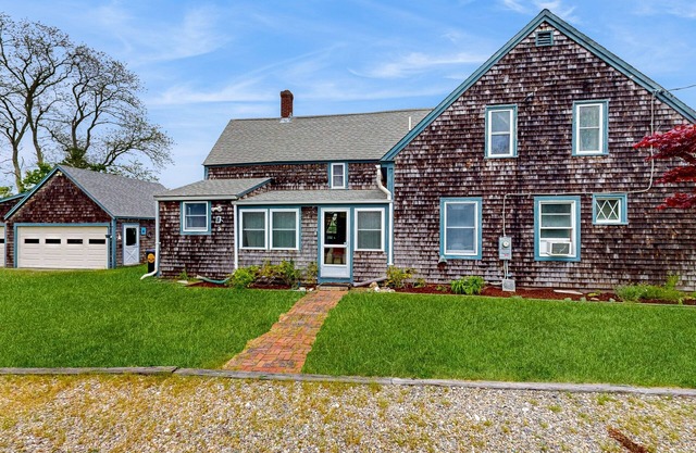 Dog-friendly retreat with patio, firepit, & tranquil river views - near beaches