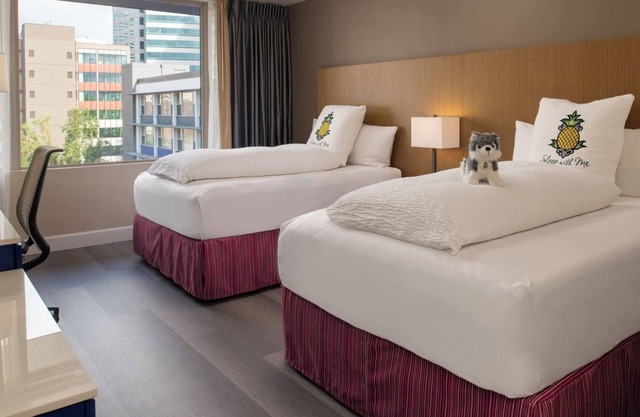 Downtown Escape: Unwind in Your Comfortable Room Across Waterfront Park
