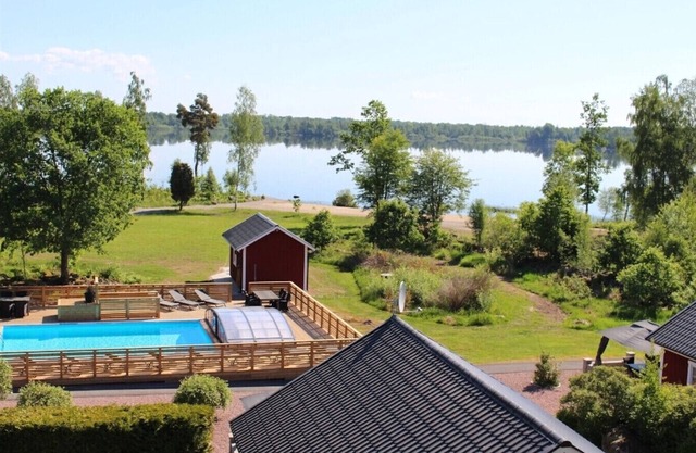 Dream location on the lake with pool, internet, sauna, fire place and boat with electric engine