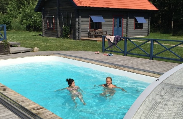 Dream vacation with pool by the lake with boat and sauna